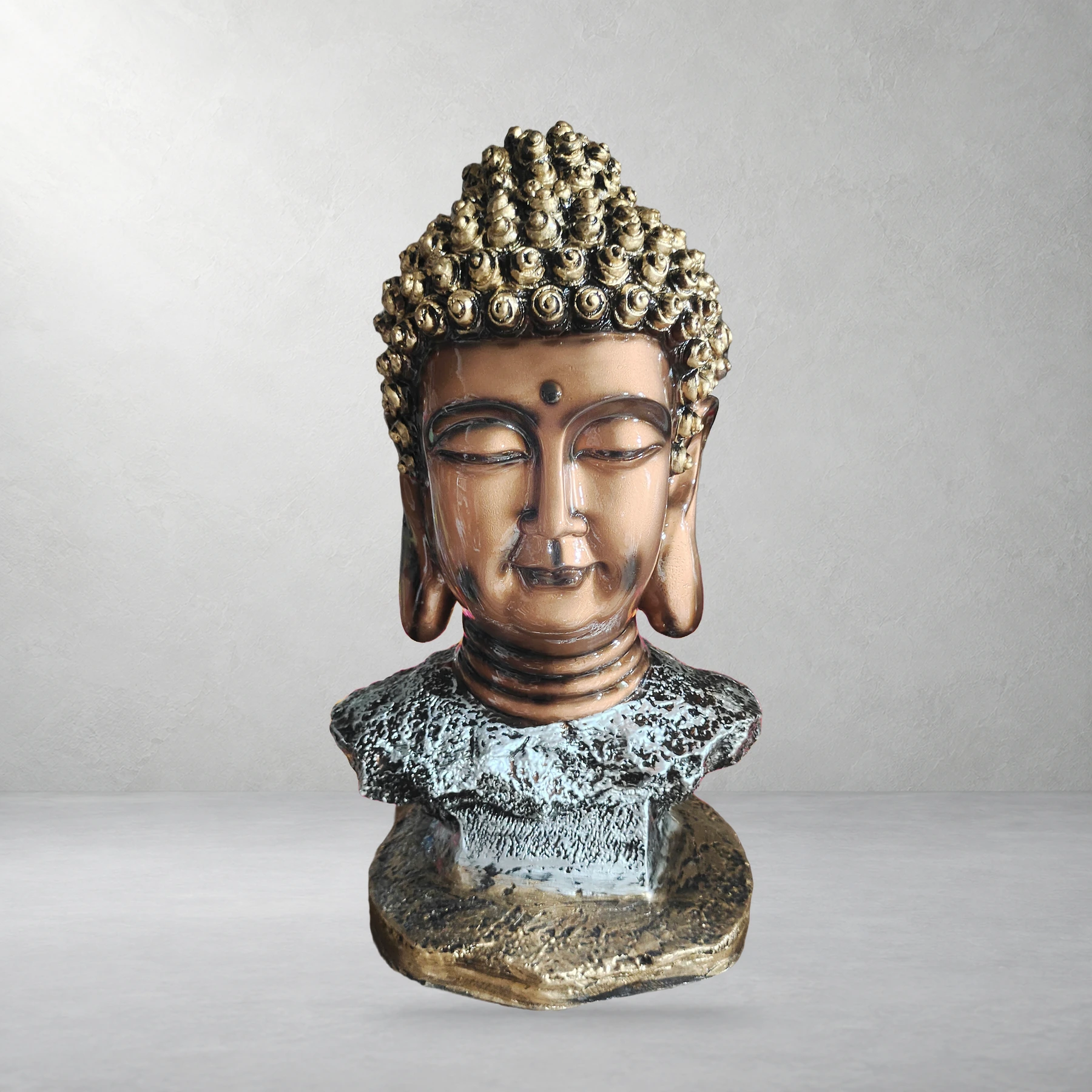Buddha bust on pedestal with bronze and gold-tone finish